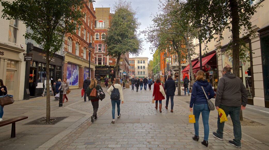 Covent Garden which includes a city and street scenes as well as a couple