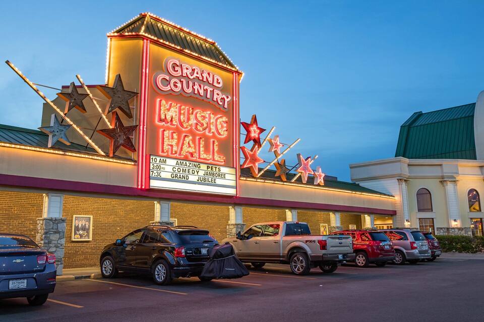 A Grand Country Music Hall with a marquee displaying showtimes.