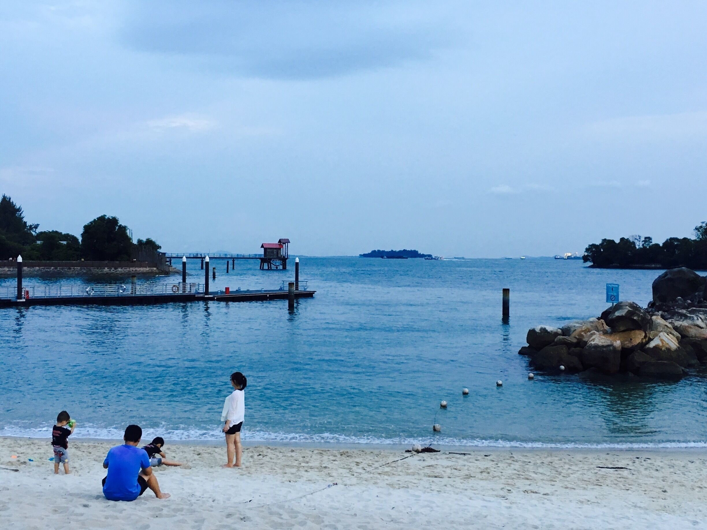 The Sunset View in Siloso Beach, Resort World, Singapore. 
 
Children are playing at the beach and parents are looking them ☺️

#Blue #Singapore #Beach #Family