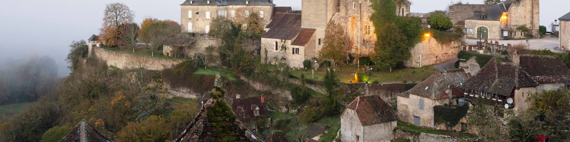 France, Midi-Pyrenees, Lot, Montvalent village illuminated before sunrise
