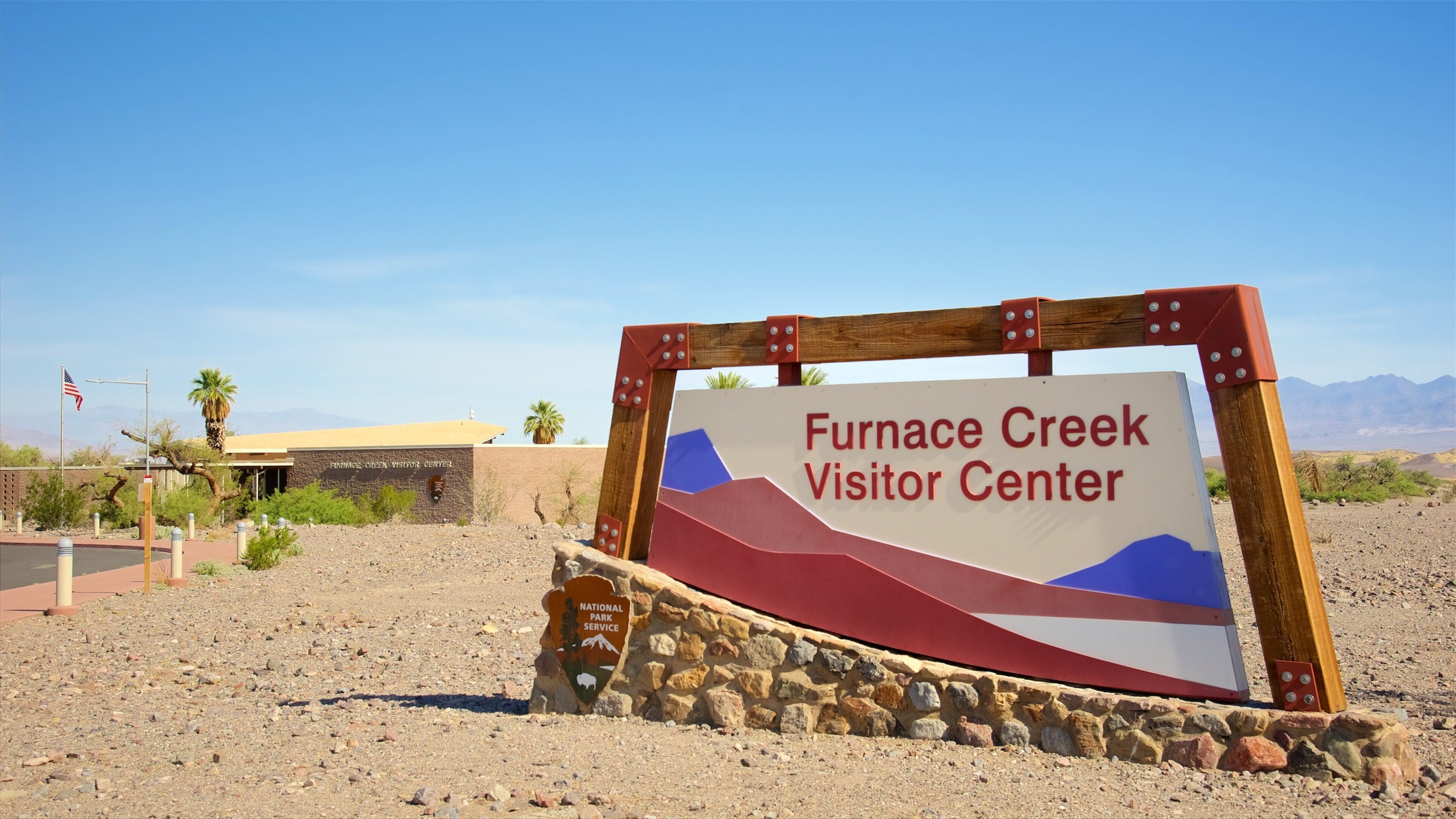 Death Valley showing signage and desert views