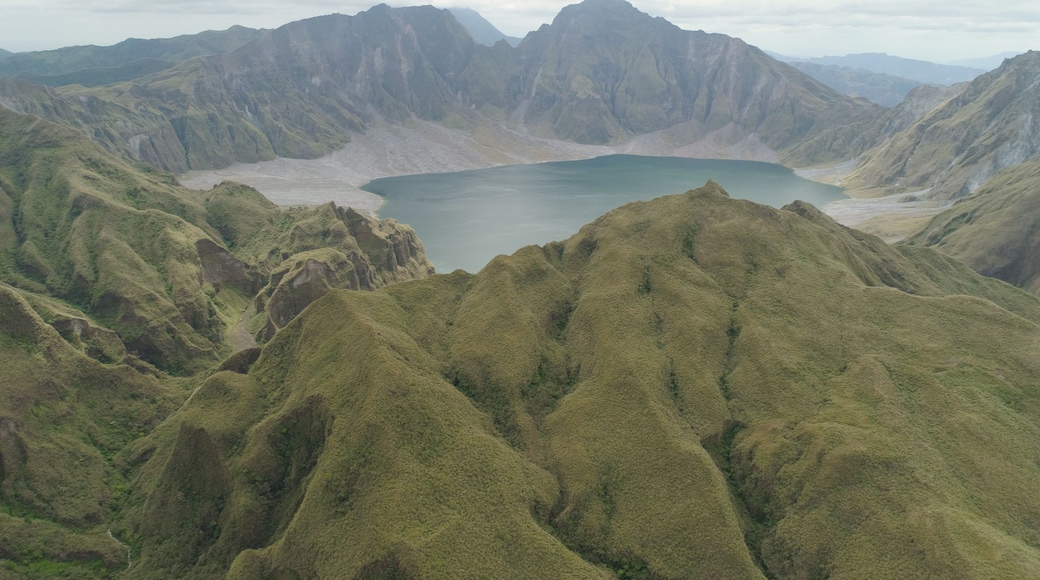 A mountainous landscape with a lake surrounded by rugged terrain.