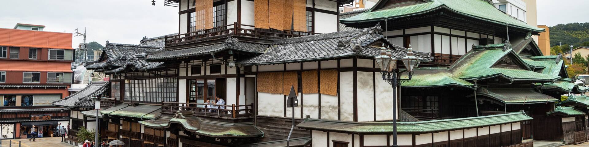 Dogo Onsen showing heritage elements and a city