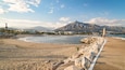 Puerto Banus Beach showing general coastal views, a sandy beach and mountains