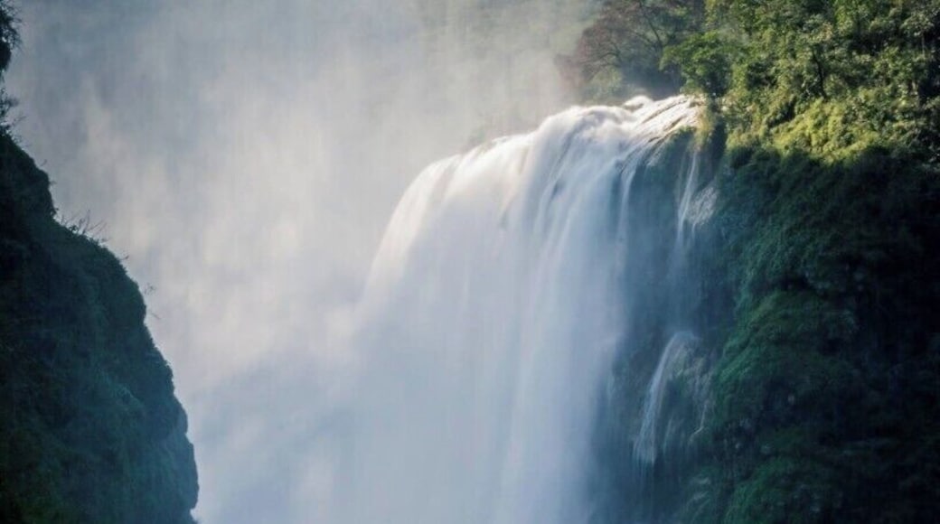 Standing on a small rock in the middle of the river, I lowered my camera as near to the water as possible in order to take this picture of the Tamul's waterfall