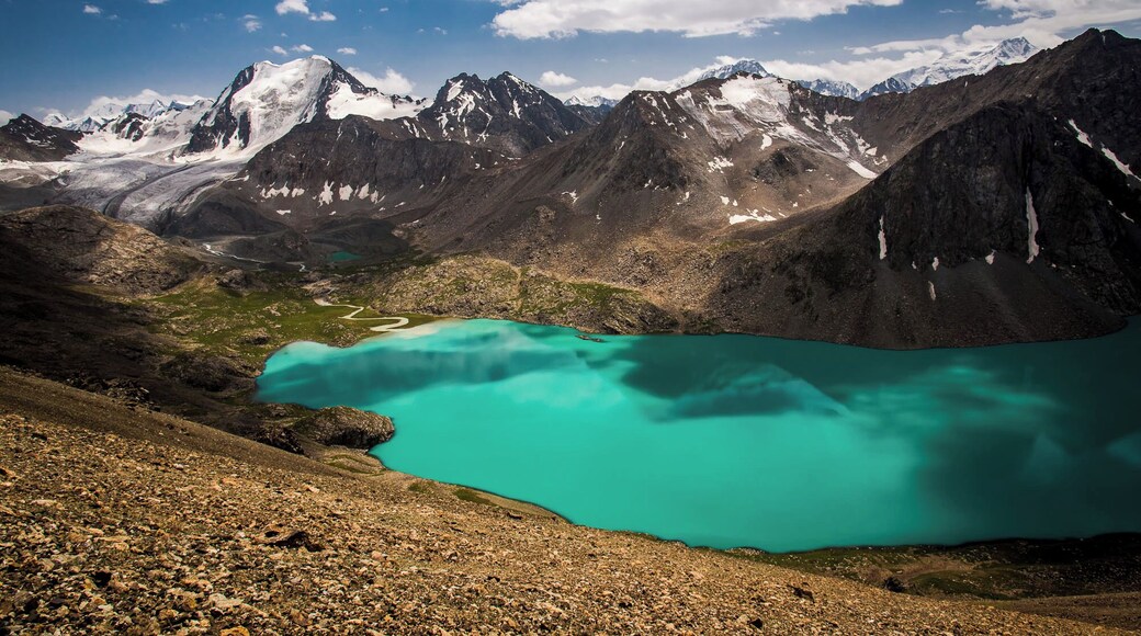 Along Lake Ala-Kul in North-East Kyrgyzstan.
The Ala-Kul Trek is probably the most popular trek in Kyrgyzstan and righteously so for alpine beauty.
But it´s a tough one! We did it in 2 days, each day clocking up roughly 1000m (3000ft) in altitude, with a maximum altitude of 3.950m (ca. 13.000ft) at Ala-Kul Pass, which is near to where this picture was taken.
#adventure
#Trovember
