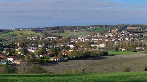 East view of a typical village built around a hill on which can be seen a 15 th cenury castle (first settlement in the 11 th century). Montmoreau, Charente, France.