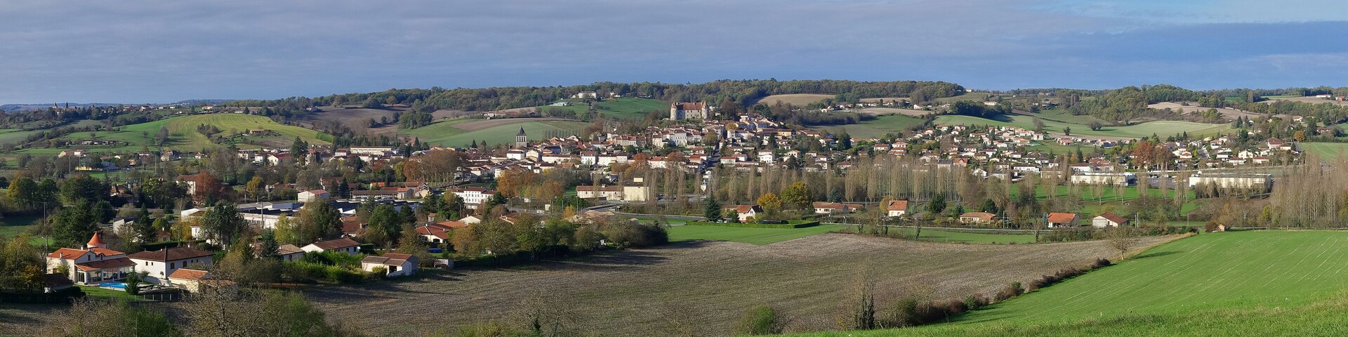 East view of a typical village built around a hill on which can be seen a 15 th cenury castle (first settlement in the 11 th century). Montmoreau, Charente, France.