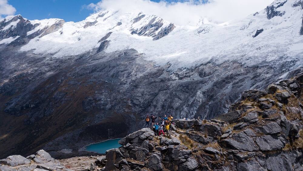 Team posing for the epic shot in Punta union pass in the Peruvian Andes
