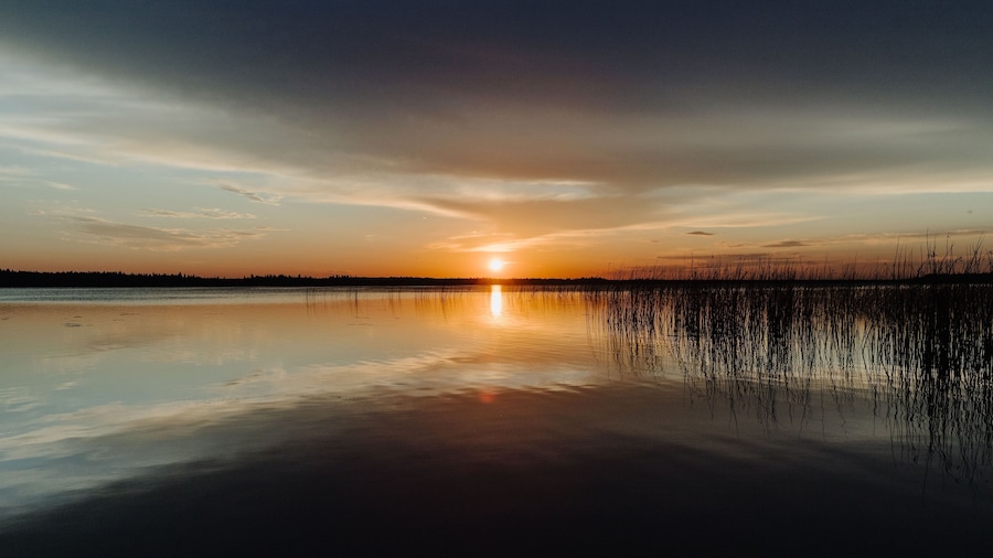 A sunset reflecting on the horizon in Candle Lake, Northern Saskatchewan, Canada