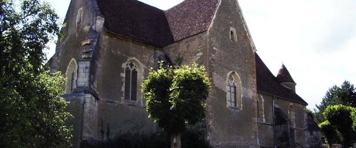 A historic church with a steeply pitched roof and arched windows.