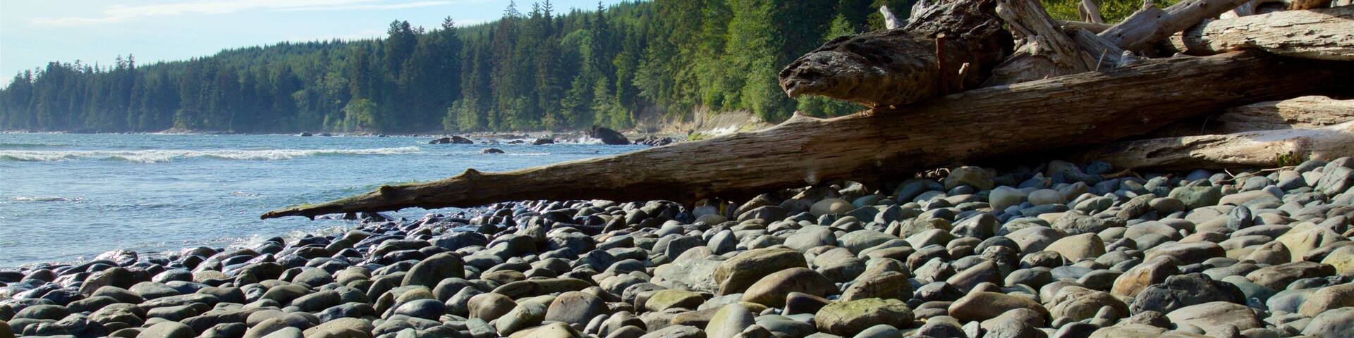 Victoria welches beinhaltet Steinstrand und See oder Wasserstelle