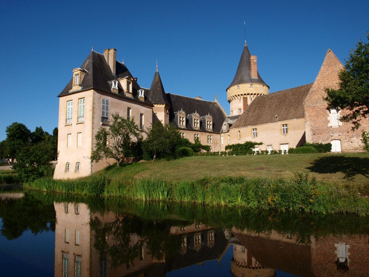 A large castle with multiple towers and a moat.