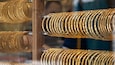 A display of intricately designed gold bangles.