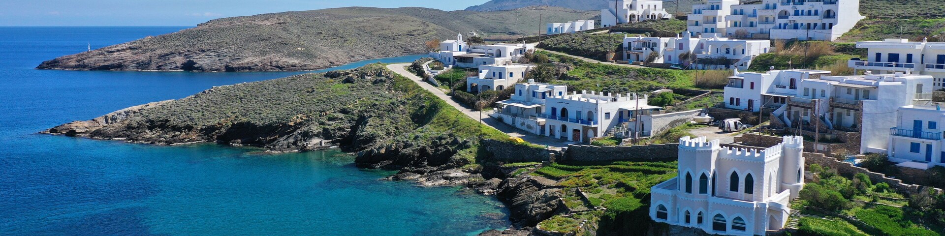 Aerial drone photo from picturesque seaside fishing village of Loutra famous of hot springs in island of Kythnos at spring, Cyclades, Greece