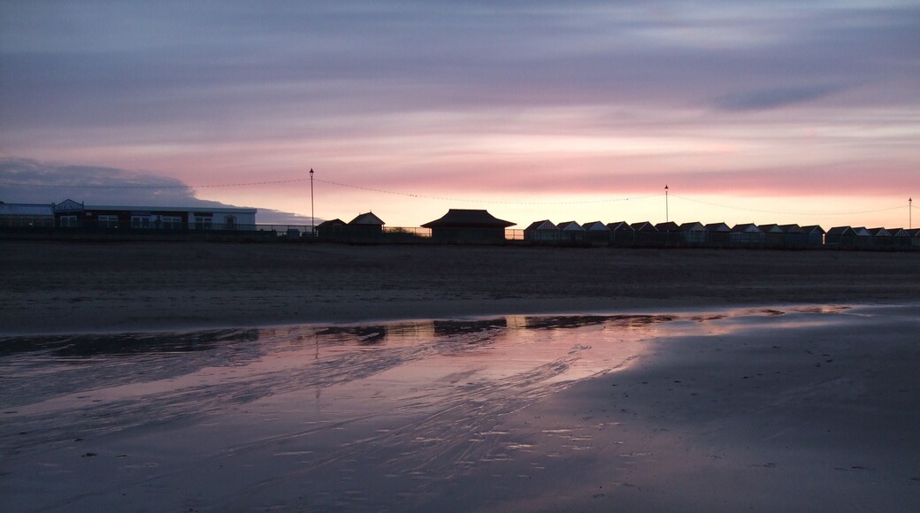 Beach huts at Sutton on Sea. Taken in silhouette against a setting spring sun.1804164