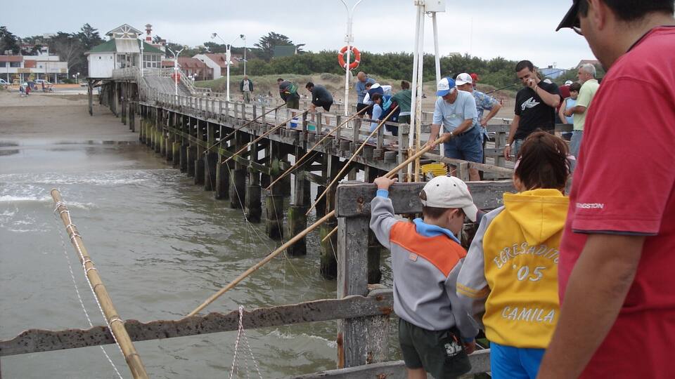 A pier with people fishing.