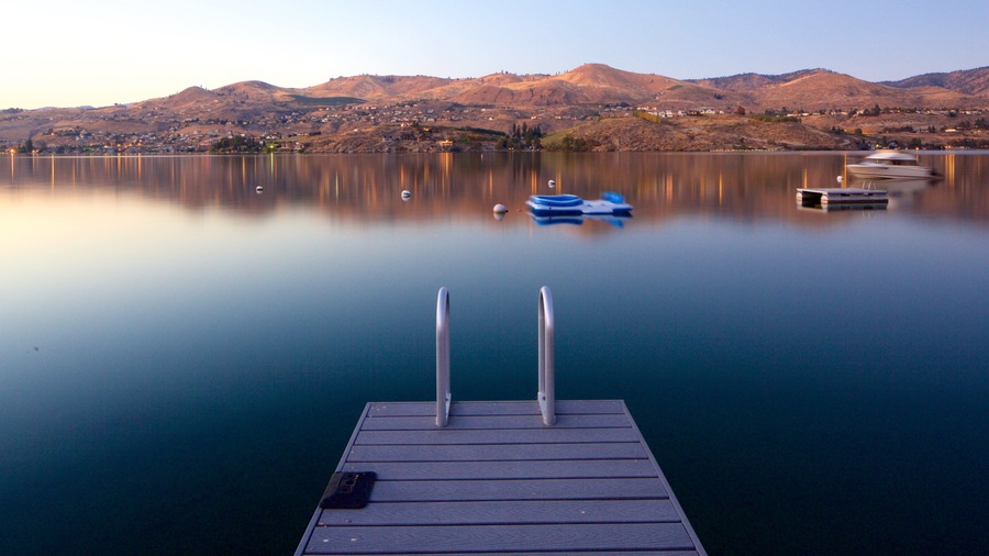 Lake Chelan featuring boating, a sunset and tranquil scenes