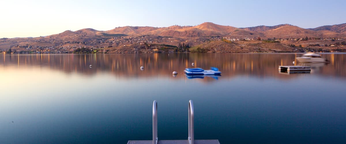 Lake Chelan which includes tranquil scenes, a lake or waterhole and boating