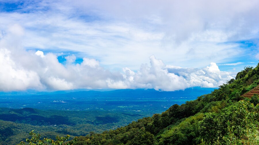 View of high hills and big clouds in the blue sky on Doi Mon Chaem, Chiang Mai, Thailand.