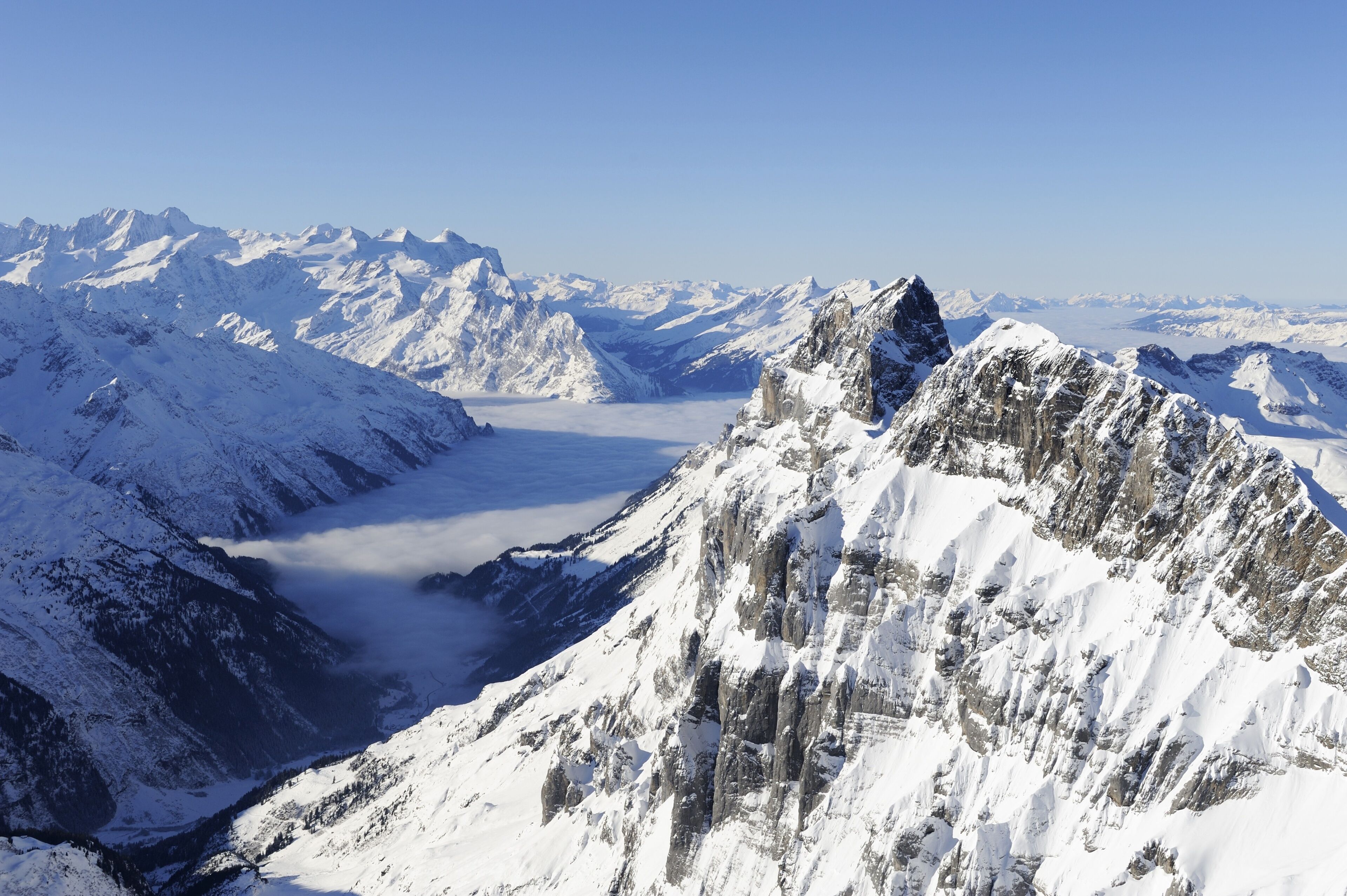 View from Titlis mountain into the Bernese Alps, with Eiger, Moench and Jungfrau mountains in the distance, Engelberg, Obwalden, Switzerland, Europe