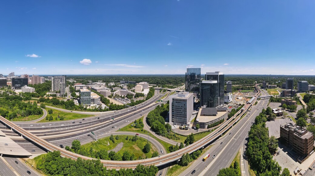 Aerial view of road interchanges, subway line, highways and skyscrapers in downtown Tyson's Corner, Virginia.