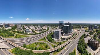 Aerial view of road interchanges, subway line, highways and skyscrapers in downtown Tyson's Corner, Virginia.