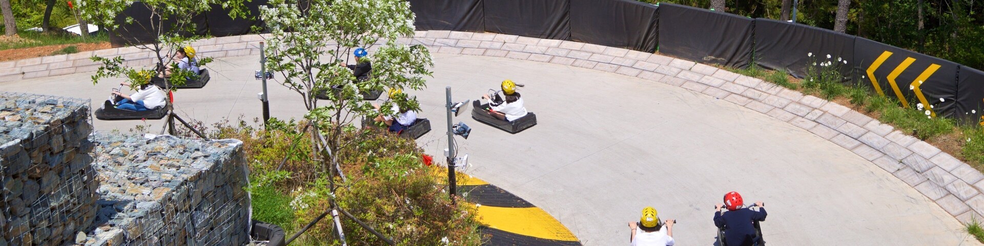 Skyline Luge Tongyeong as well as a small group of people