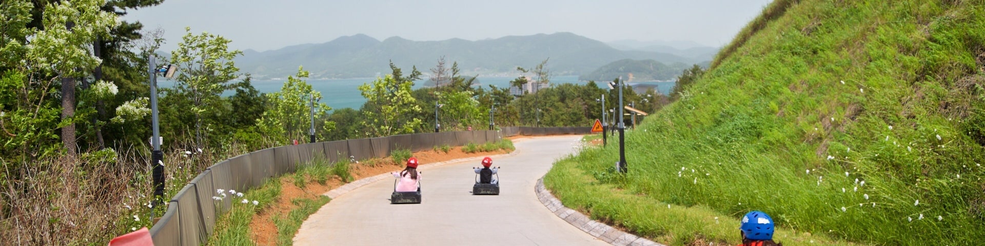 Skyline Luge Tongyeong as well as a small group of people
