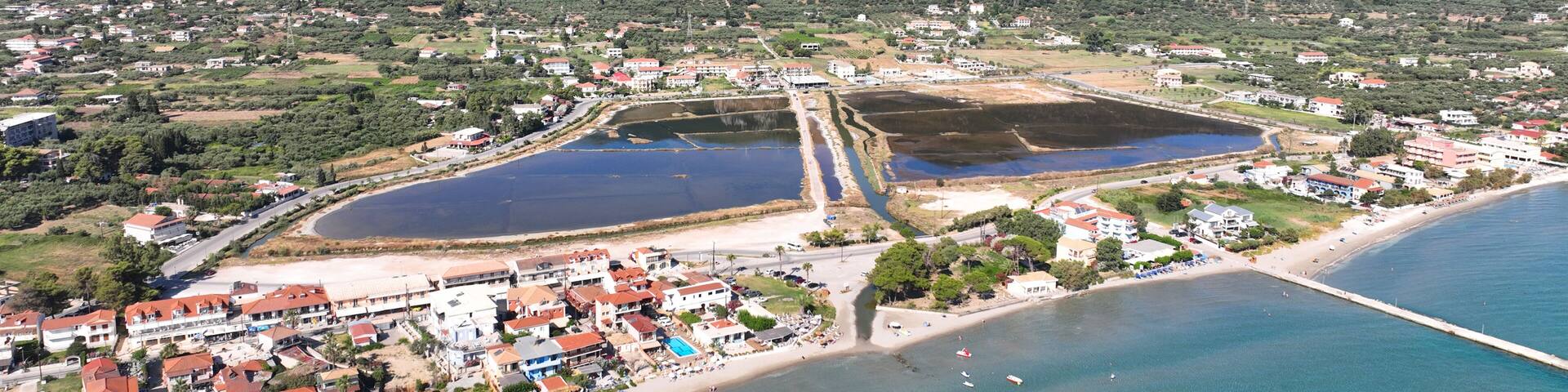 Aerial drone photo of famous seaside village of Alykes featuring popular resort beach of Alykanas in northern part of Zakynthos island, Ionian, Greece