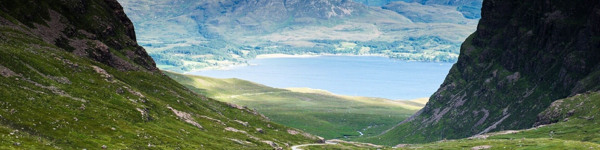 The Bealach na Ba ("Pass of the cattle") is not a single attraction, it doesn't have a visitor centre, and there are no visitor facilities as such.
But the Bealach is an unforgettable drive up and along one of the most dramatic roads on mainland UK, rivalling many a Swiss mountain pass and with terrific views across much of Wester Ross, the whole of Skye, and the Islands of Rum and the Outer Hebrides. You will NOT forget this drive as long as you live!