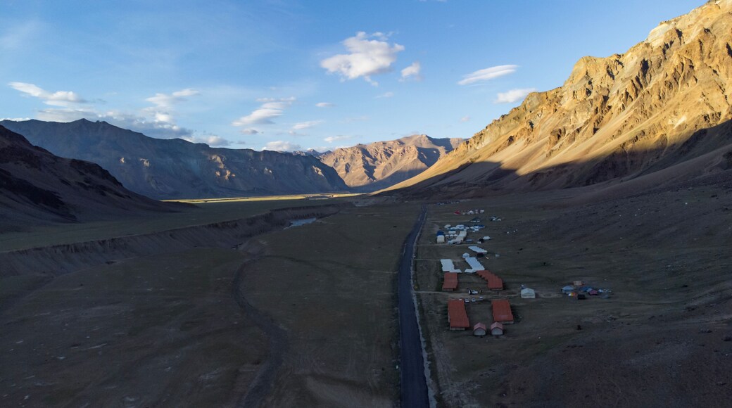 An aerial view of beautiful himalayan mountains in the evening at sarchu with tsarap river, keylong-leh road lahul, himachal pradesh, India.