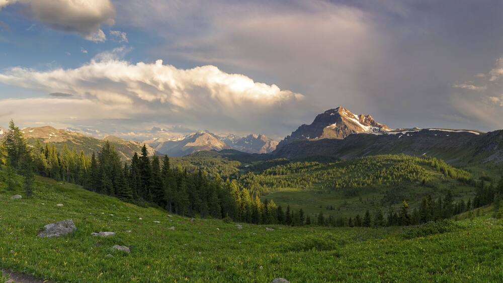 Dramatic Stormy Sky and Wide Panoramic Landscape of Healy Pass Meadows on a great summertime hiking trail in Canadian Rocky Mountains, Banff National Park