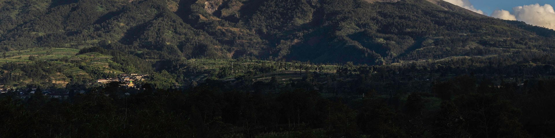 Panoramic view of the great Mount Merapi Volcano with clear blue sky in the background viewed from Selo Boyolali, Central Java - Indonesia.
