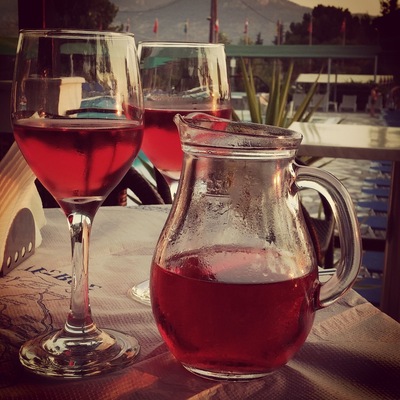 Enjoying the local rose by the pool.