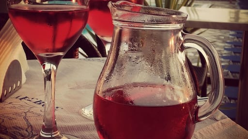 Enjoying the local rose by the pool.