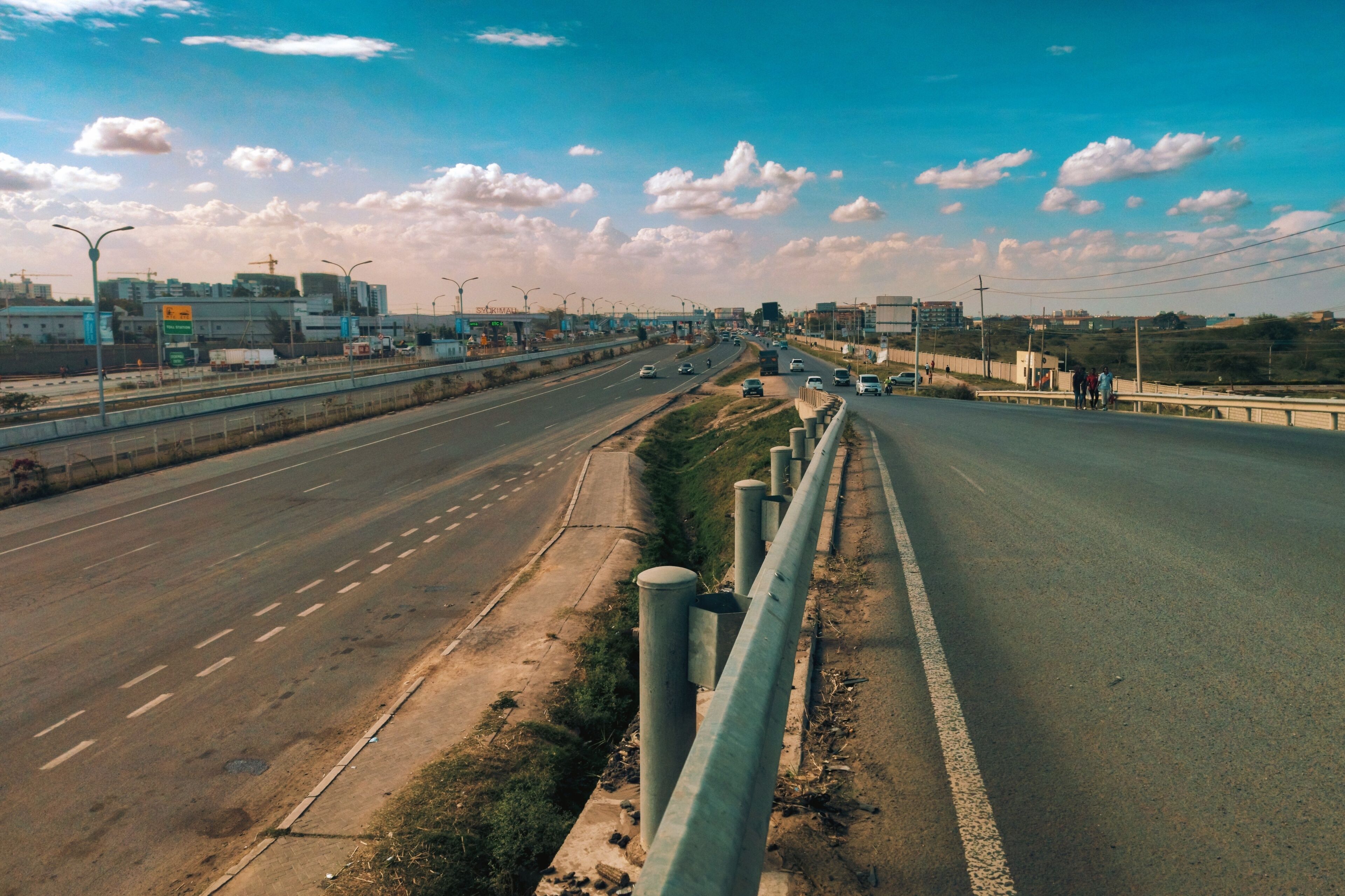 Elevated view of multi-lane highway in Nairobi Kenya with trucks cars and pedestrians at Syokimau, Kenya 