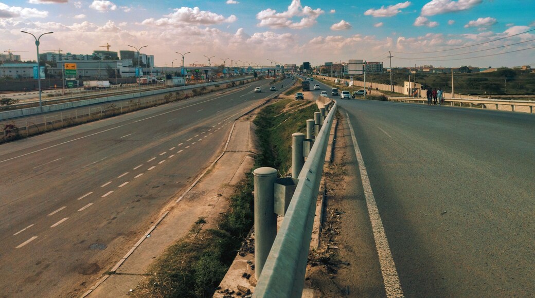 Elevated view of multi-lane highway in Nairobi Kenya with trucks cars and pedestrians at Syokimau, Kenya