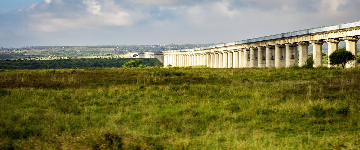 View of the collosal Mombasa-Nairobi Standard Gauge Railway Bridge through the Nairobi National Park Nature Reserve near Nairobi, Kenya