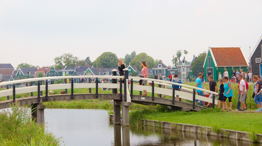Zaanse Schans featuring a small town or village, a bridge and a lake or waterhole