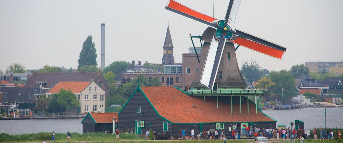 Zaanse Schans which includes a small town or village, general coastal views and a windmill