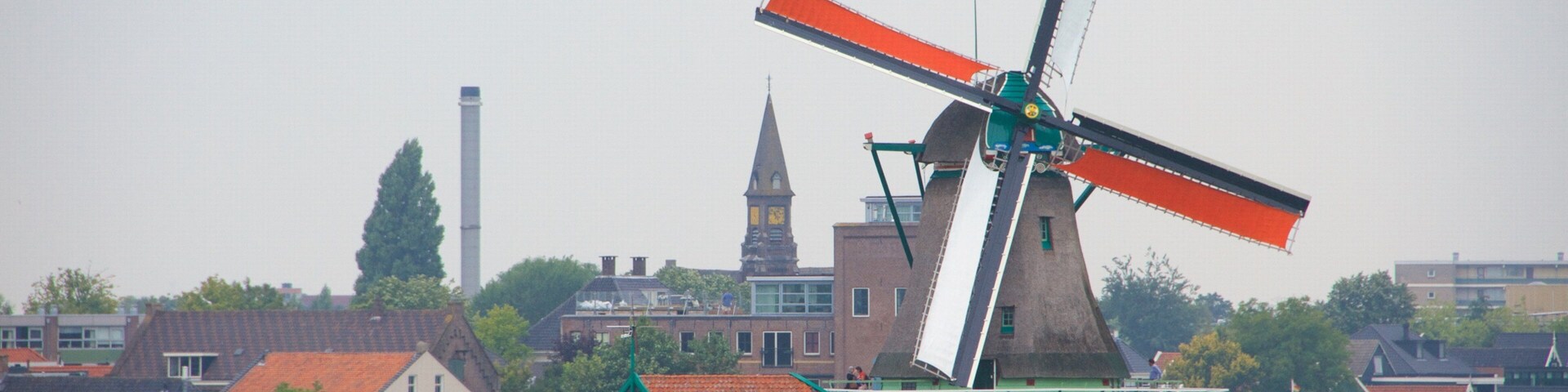 Zaanse Schans which includes a small town or village, general coastal views and a windmill