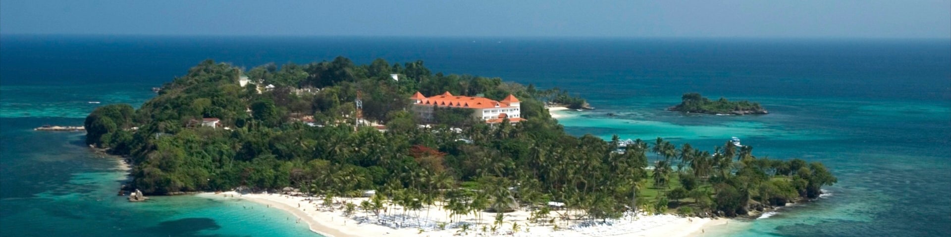 Dominican Republic which includes tropical scenes, a beach and landscape views