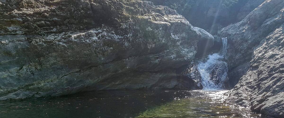 One of many small pools of water, with spectacular mini waterfalls that can be followed up the mountain to its source. This particular one can be found on the north side of the island, in the village of Therma, on a dirt road to the left of the taverna.
