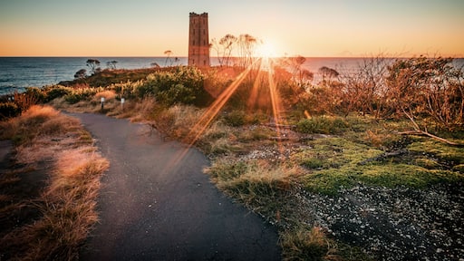 The view of the Boyd's Tower in Eden with the sunrise from the sea