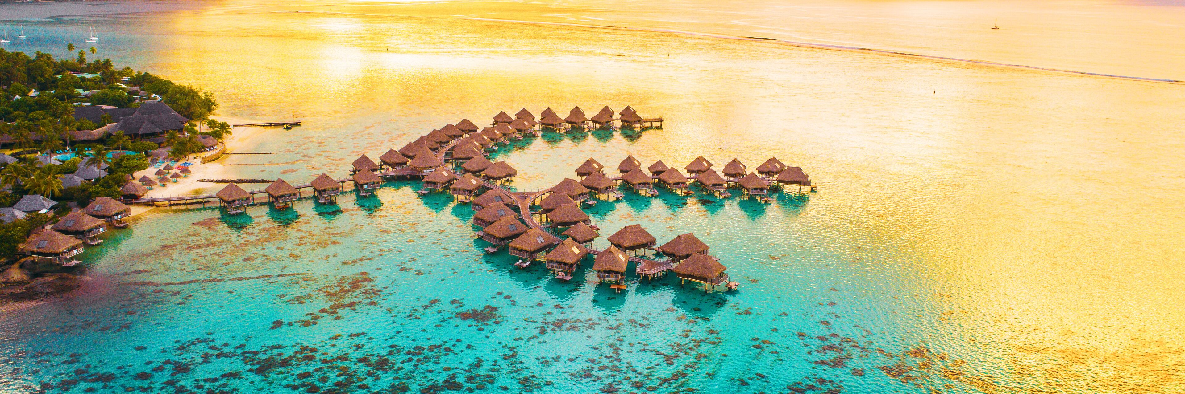 Luxury travel vacation destination panoramic banner. Romantic honeymoon getaway in overwater bungalows villas of Tahiti resort, Bora Bora, French Polynesia. Landscape copy space panorama.