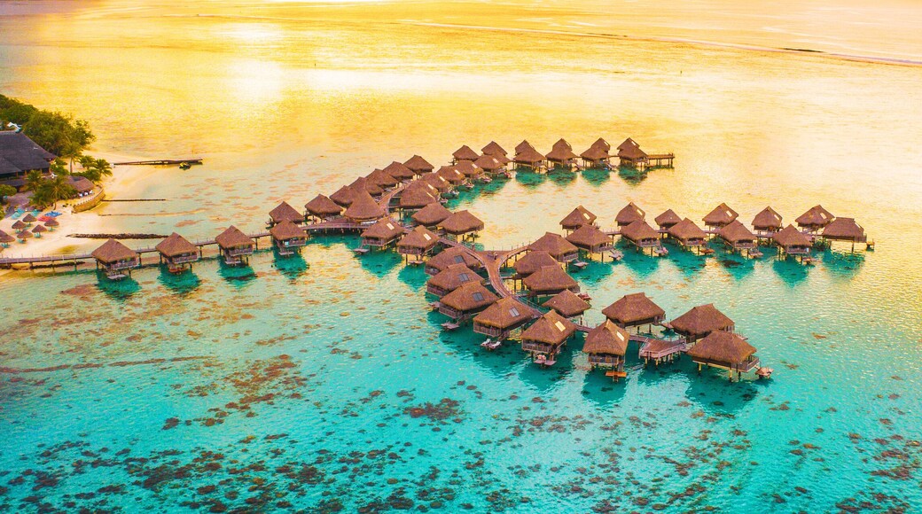 Luxury travel vacation destination panoramic banner. Romantic honeymoon getaway in overwater bungalows villas of Tahiti resort, Bora Bora, French Polynesia. Landscape copy space panorama.