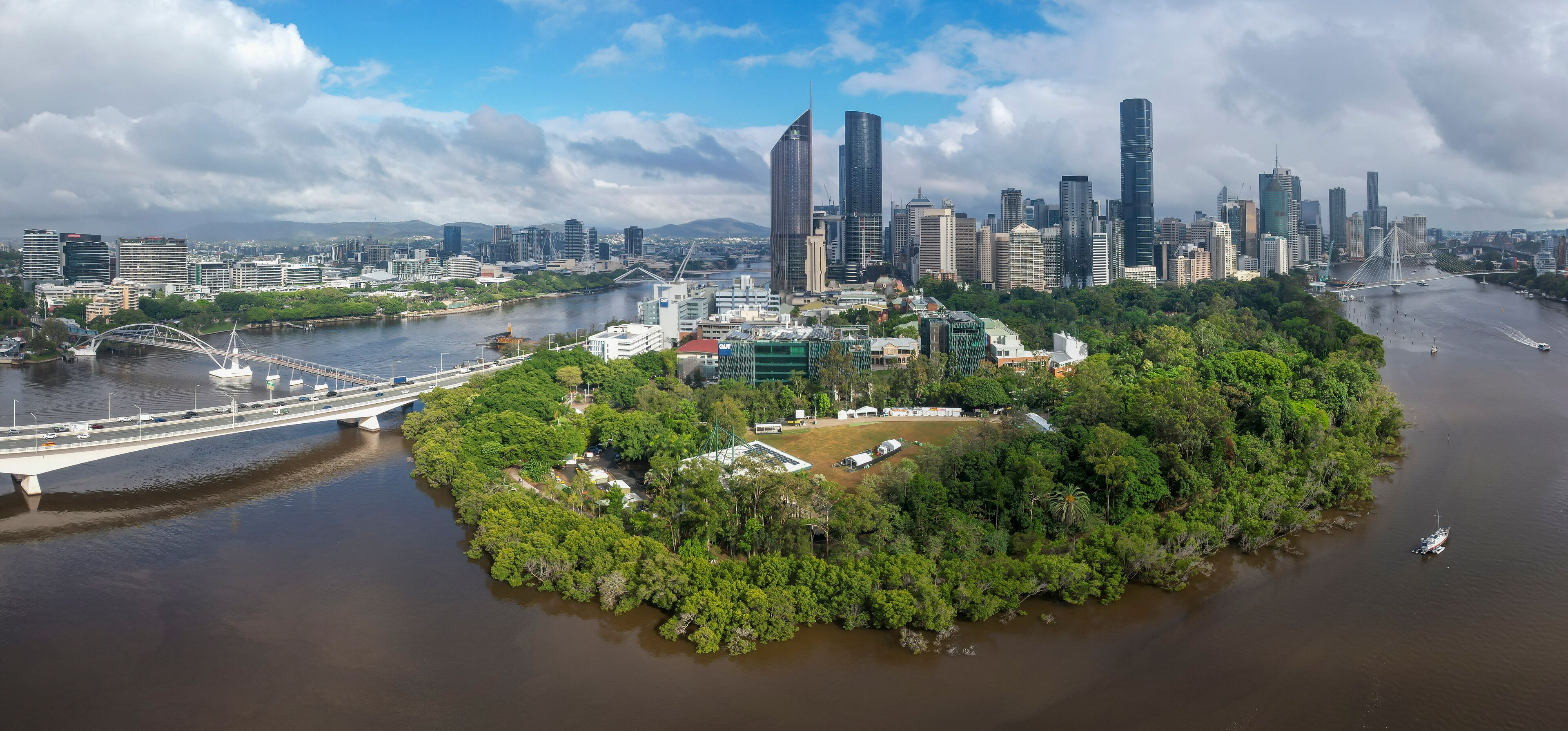 Aerial view of Brisbane City with the Brisbane River, City Botanic Gardens, and modern skyscrapers, Brisbane, Australia.