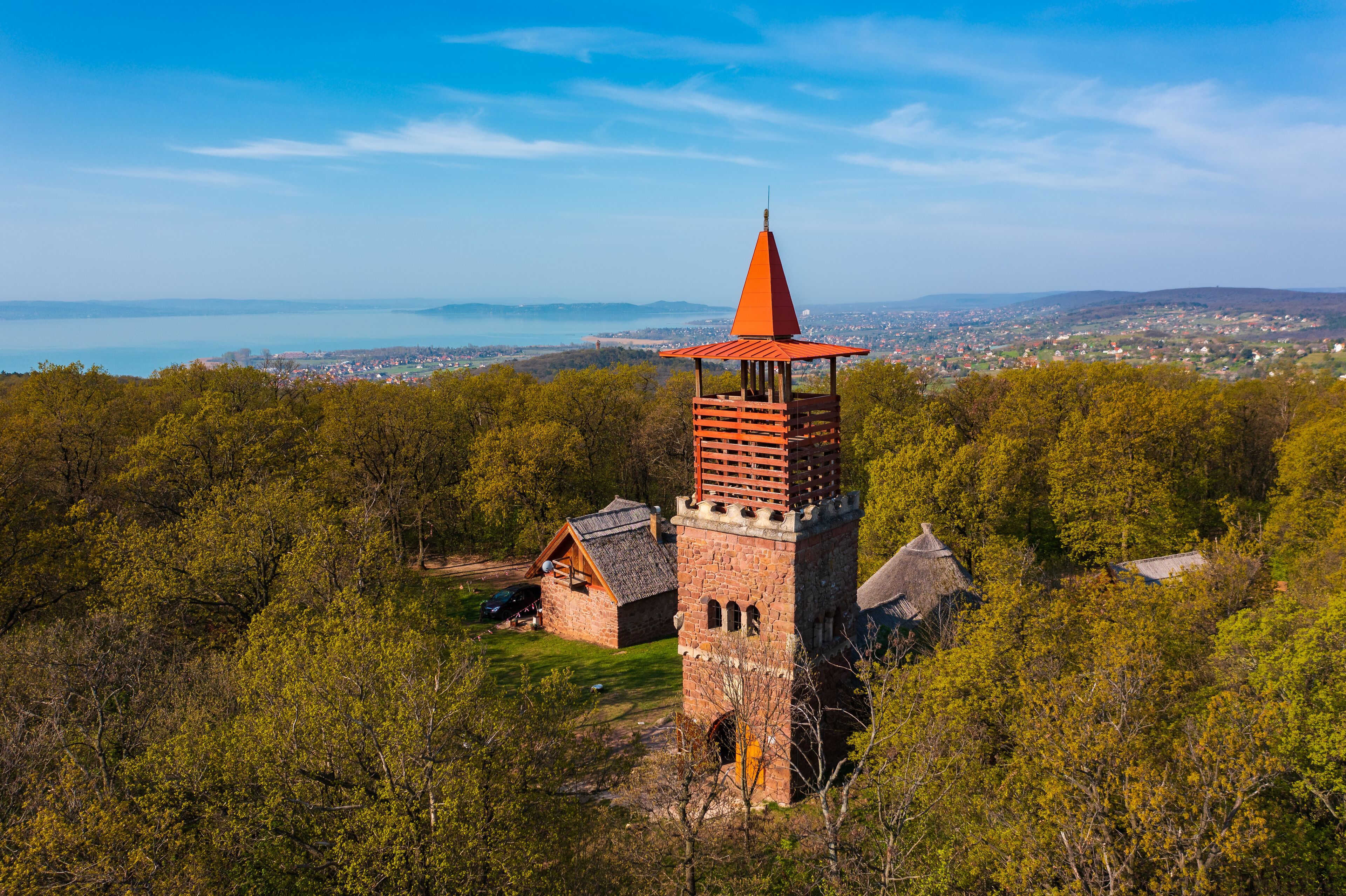 Alsóörs, Hungary - Aerial view about lookout tower on Csere mountain, with lake Balaton at the background. Spring landscape. Hungarian name is Csere-hegyi kilátó.