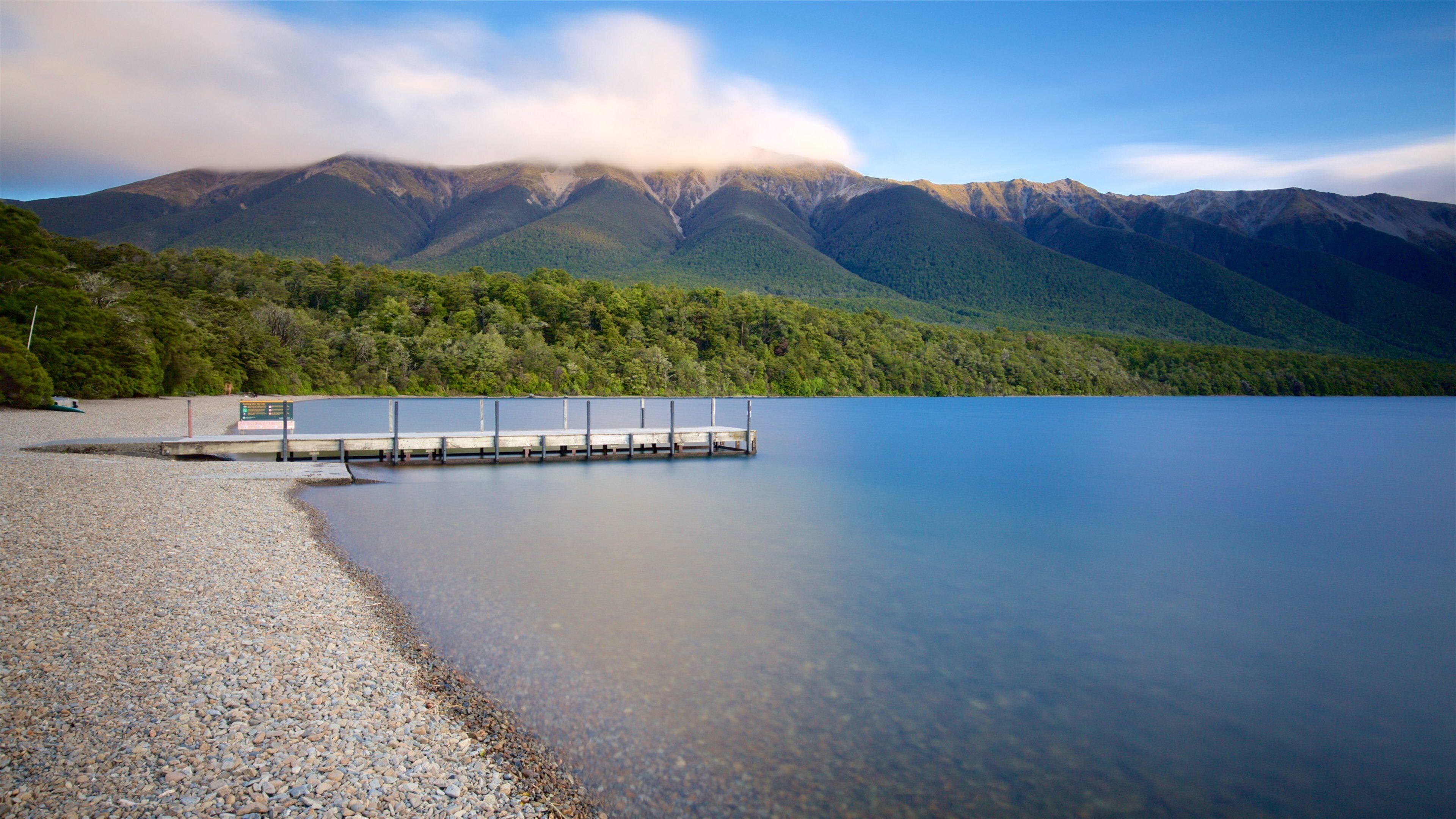 Tasman Region which includes a lake or waterhole and a pebble beach